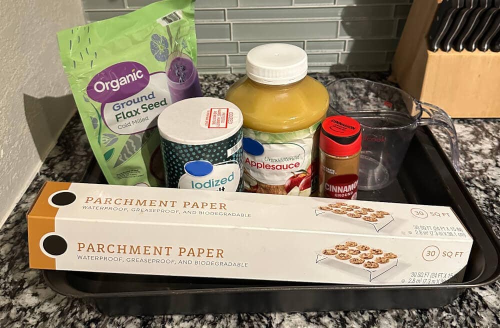 Ingredients for low-starch apple cinnamon horse cookies including flaxseed, cinnamon, and applesauce