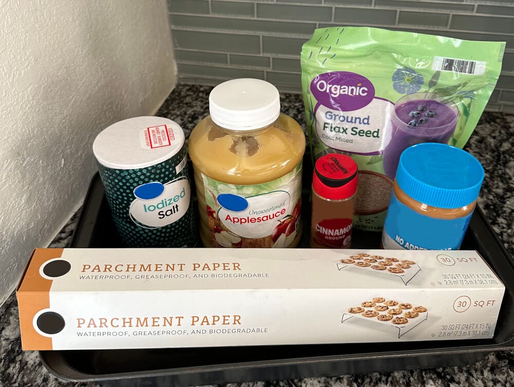 Ingredients for low-sugar peanut butter horse cookies including flax, peanut butter, and applesauce