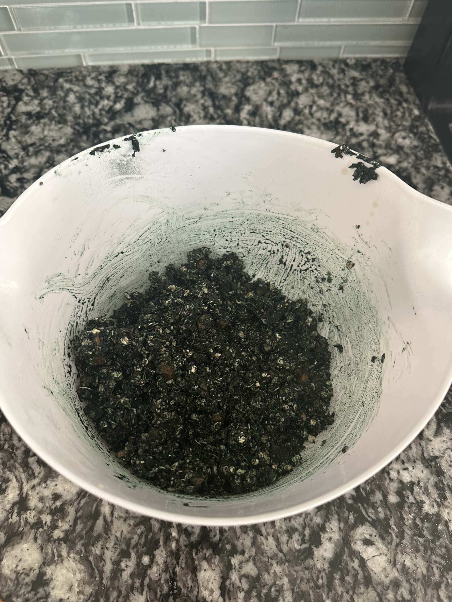 Horse treat dough being mixed in a bowl with a spoon
