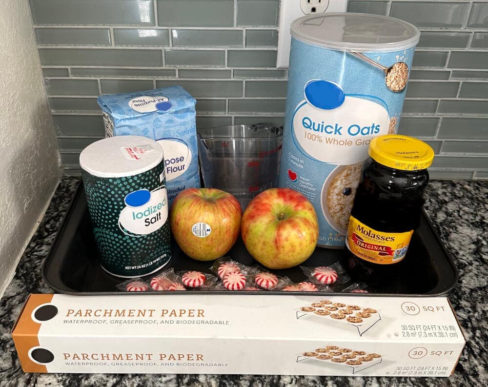 Ingredients for peppermint horse cookies including crushed peppermints, oats, and molasses