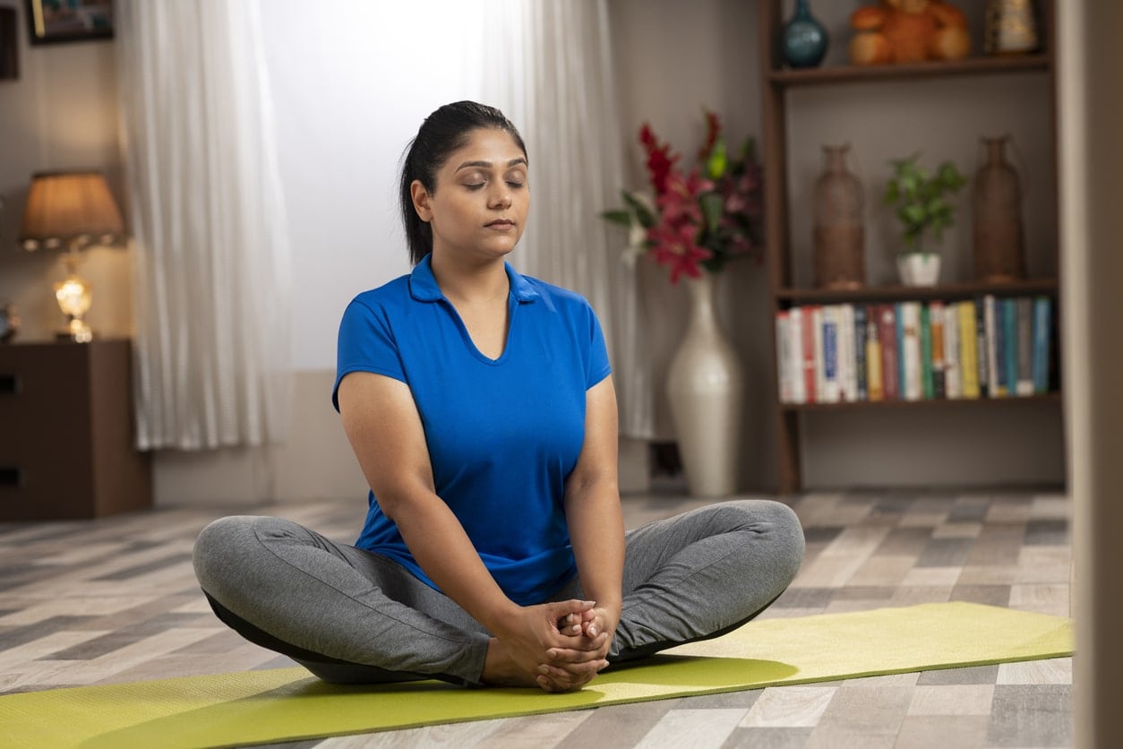 image of woman performing a butterfly leg adductor stretch
