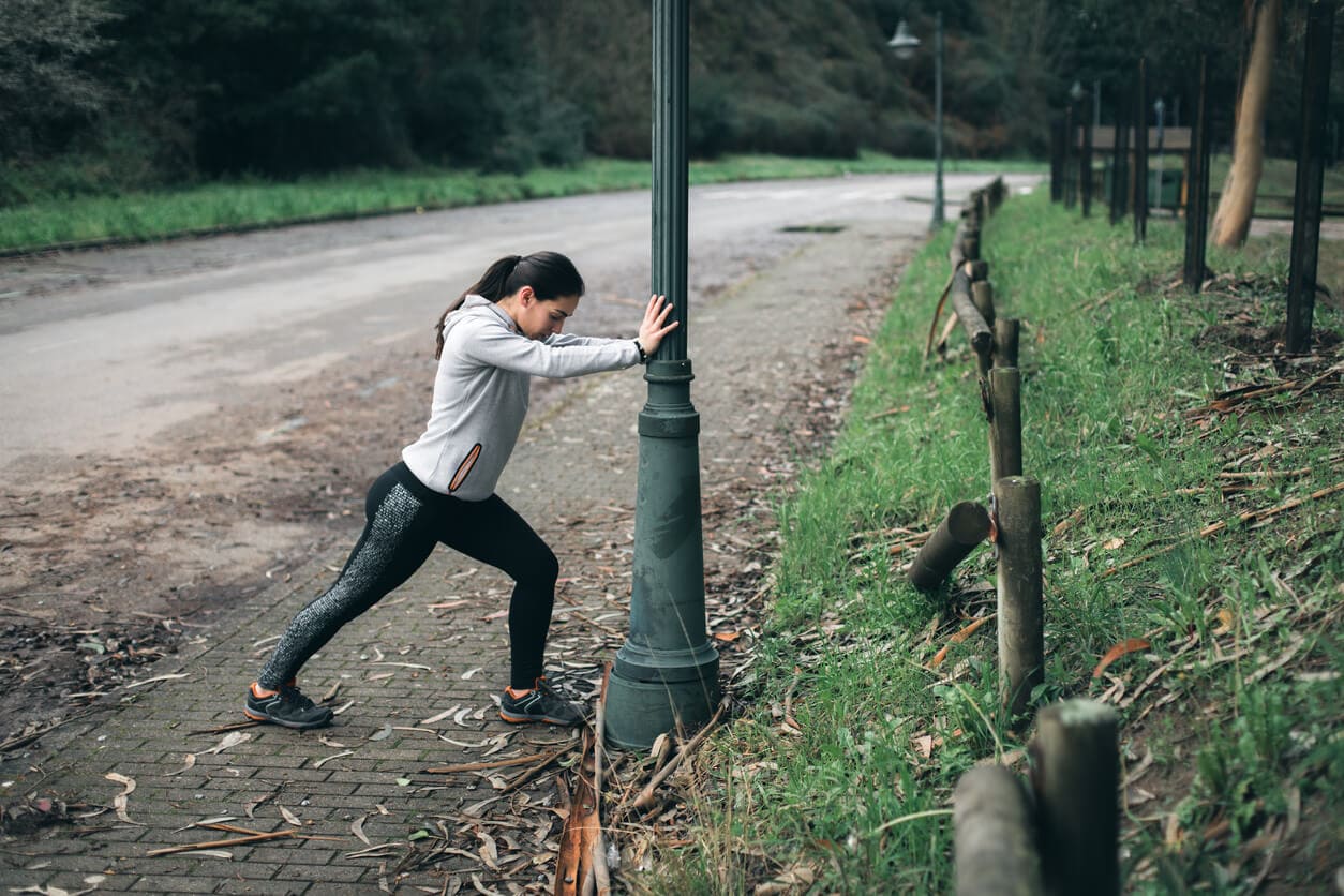 image of woman performing an isometric standing lunge