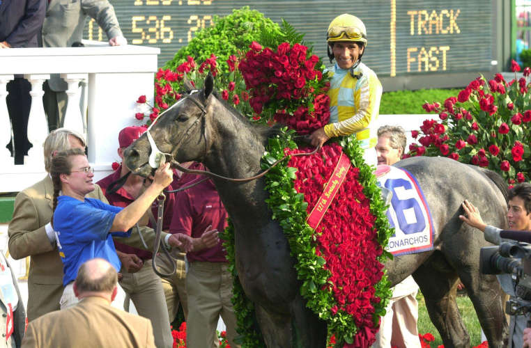 photo of jockey and horse receiving rose garland at the kentucky derby