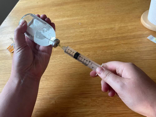 drawing medication into a syringe
