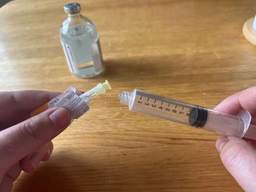 opening a sterile needle package